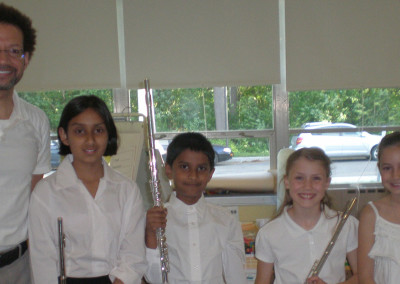 Young flutists with teacher