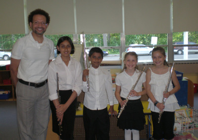 Young flutists with teacher